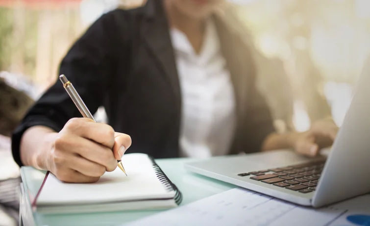 woman writing notes