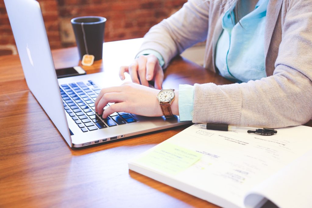 woman working on notebook